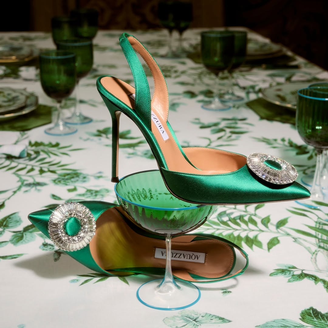 Raise an Aquazzura handblown Murano

glass to a joyful 2025! Let the celebrations begin with the emerald green Crystal Hoop Sling featuring a dazzling bejeweled upper.

Photo Credits: <a href="/aquazzura/">AQUAZZURA</a>

#AQUAZZURA

#AQUAZZURAPumps

#AQUAZZURAHoliday Moments