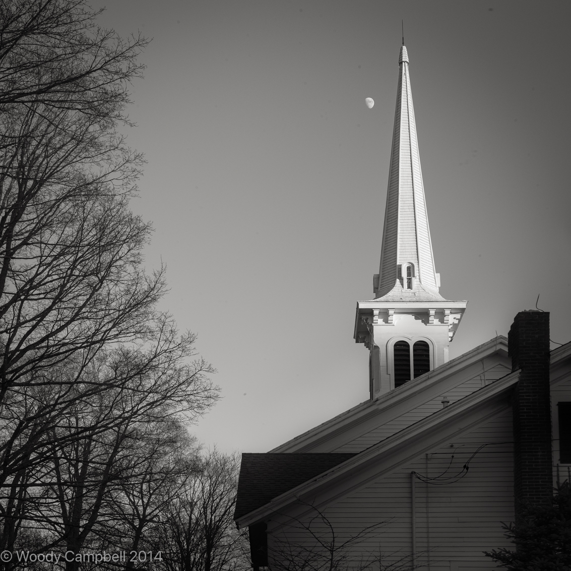 Woody_Campbell's tweet photo. Sharing a capture from 10 years ago, day 1902 of my 15-year daily photo project! This black-and-white shot of the Congregational Church steeple in New Preston, CT, with the moon peeking behind, reflects my journey with the Leica. #Photography #Leica #DailyPhotoProject #NewPreston https://t.co/1oUakLPygp