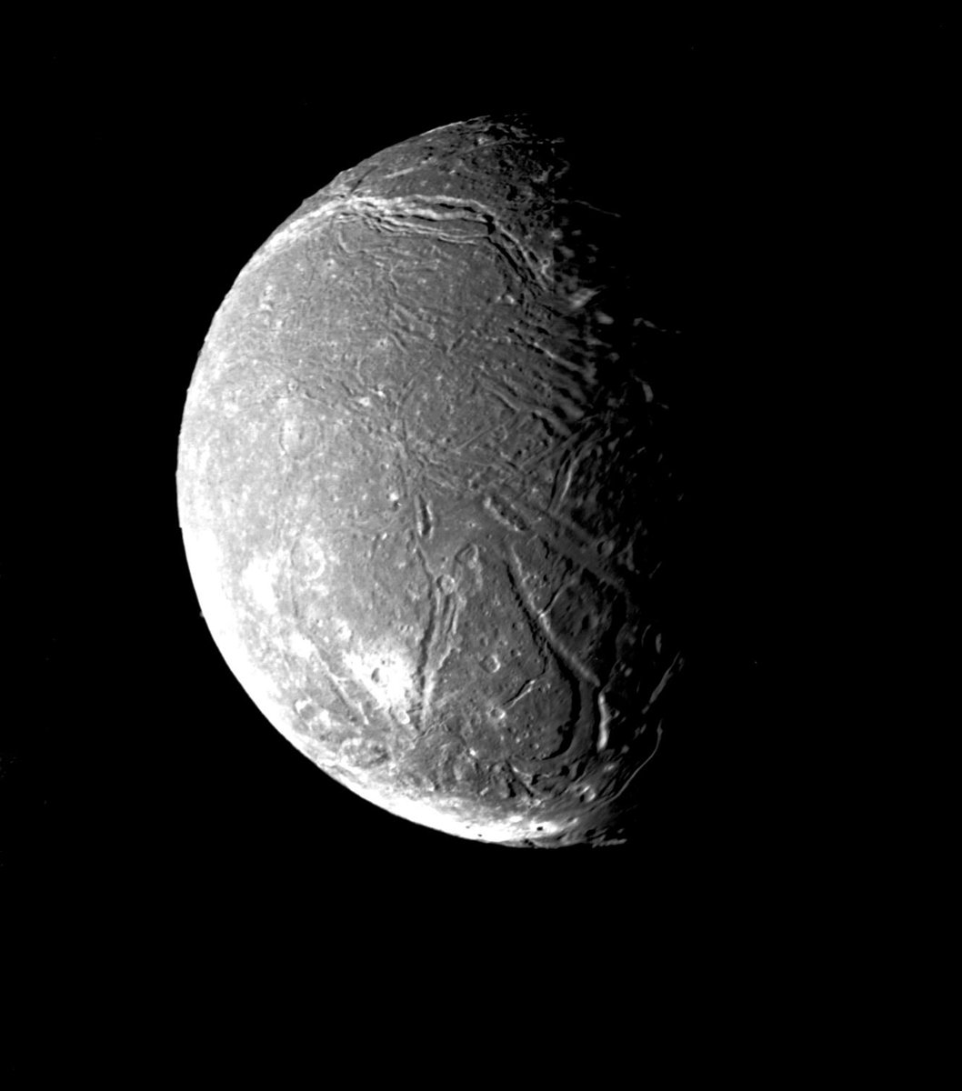 Cmdr_Hadfield's tweet photo. Ariel, Uranus’s 4th-largest moon, is thought to be made of equal parts rock &amp; ice; @nasa is planning the Uranus Orbiter &amp; Probe mission to go see, mid 2030s. 
https://t.co/qTgWvIb9nr https://t.co/M9MKIPlO4s