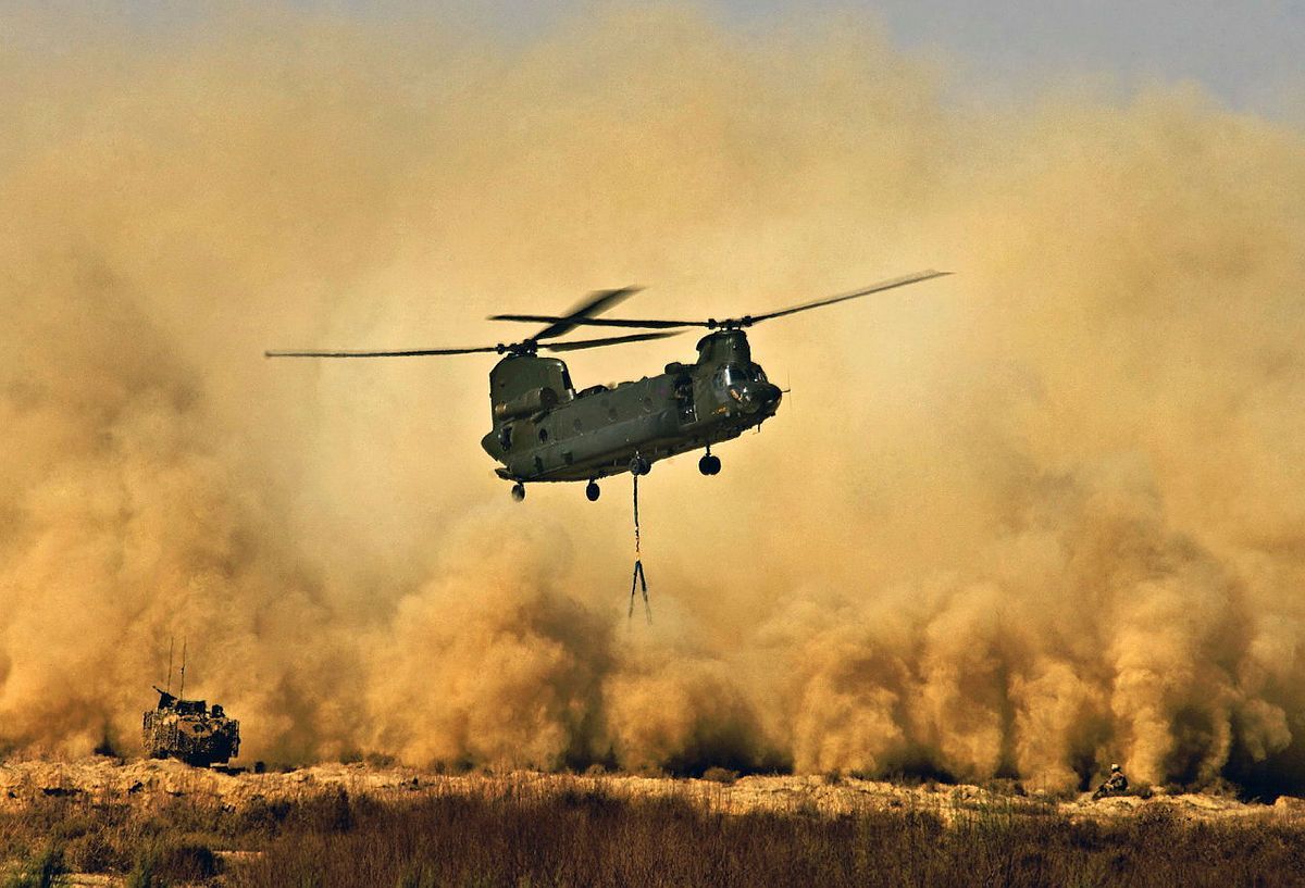 A Royal Air Force CH47 Chinook Helicopter creates a dust storm during the re-supply of Patrol Base Delhi before Op Glacier 4 in the Afghan district of Garmsir.