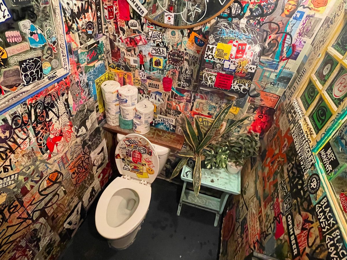 toilography's tweet photo. The loo at Forgetmenot impressed me with its heavy stickerings and corner greenery. In the end I didn’t have enough energy or warm clothes for an NY all-nighter and booked a hotel, but I was happy to add six more shitters to the gallery. Now off to the Amtrak bound for Montreal. https://t.co/3tC9P1OL7E
