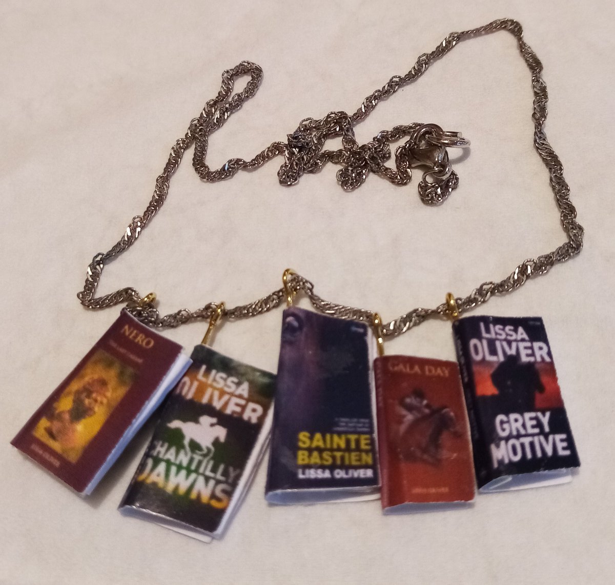 Lissa Oliver (@oliverlissa) on Twitter photo A beautiful handmade necklace by my sister featuring all my novels from <a href="/Maverick_House/">MaverickHouse</a> in perfect miniature <a href="/IrishWritersCtr/">Irish Writers Centre</a> <a href="/WritersUnion_ie/">Irish Writers' Union</a> #book A beautiful handmade necklace by my sister featuring all my novels from <a href="/Maverick_House/">MaverickHouse</a> in perfect miniature <a href="/IrishWritersCtr/">Irish Writers Centre</a> <a href="/WritersUnion_ie/">Irish Writers' Union</a> #book