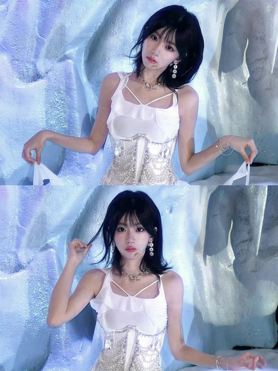 wrapped in a cascade of silk and shimmering chains