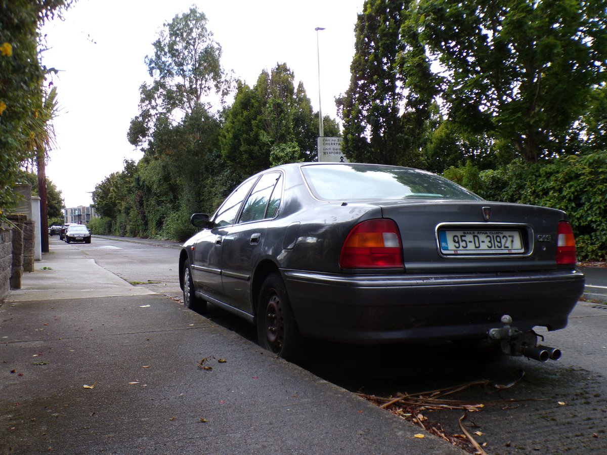 I found this rather unloved Rover 620 back in 2021. I thought I'd visit it this week; surprisingly, it's still there.

It's been off the road since 2016 and looks decidedly tatty to suit - with a mostly detached exhaust and some nasty dents and scrapes on its wings and flanks.