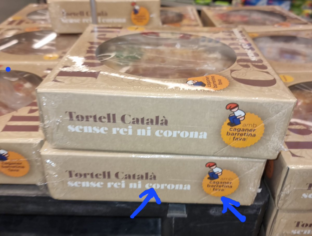 Tortell català sense rei ni corona, amb caganer, barretina i fava