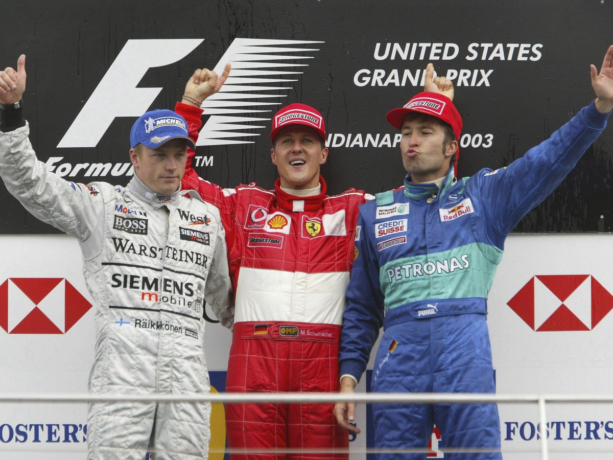 2003_f1's tweet photo. The podium of the 2003 #USAGP 🇺🇸: Kimi Raikkonen (McLaren, P2), winner Michael Schumacher (Ferrari) and a weirdly-smiling Heinz-Harald Frentzen (Sauber) in Indianapolis @IMS, 28th September, 2003. (📸: Clive Rose/Bongarts /Getty Images) https://t.co/Jxi4C2Bg9W