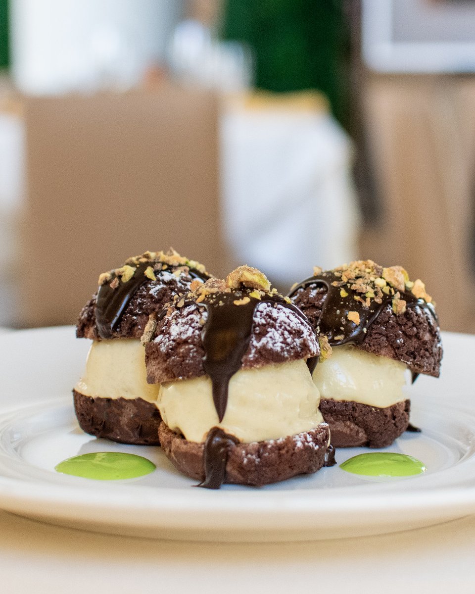Come enjoy our decadent Chocolate Profiteroles with Pistachio Ice Cream, Dark Chocolate Sauce, and Pistachio Croquant. The perfect treat to start your week at Mistral.