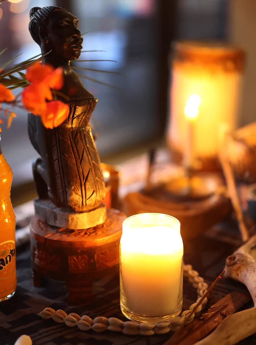 Alter with figurine and burning candles