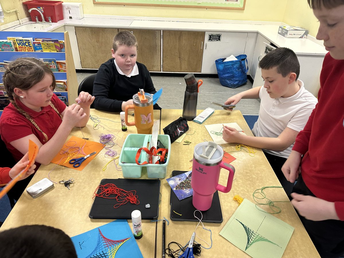 Sewing parabolic curves to create our new year calendars.
