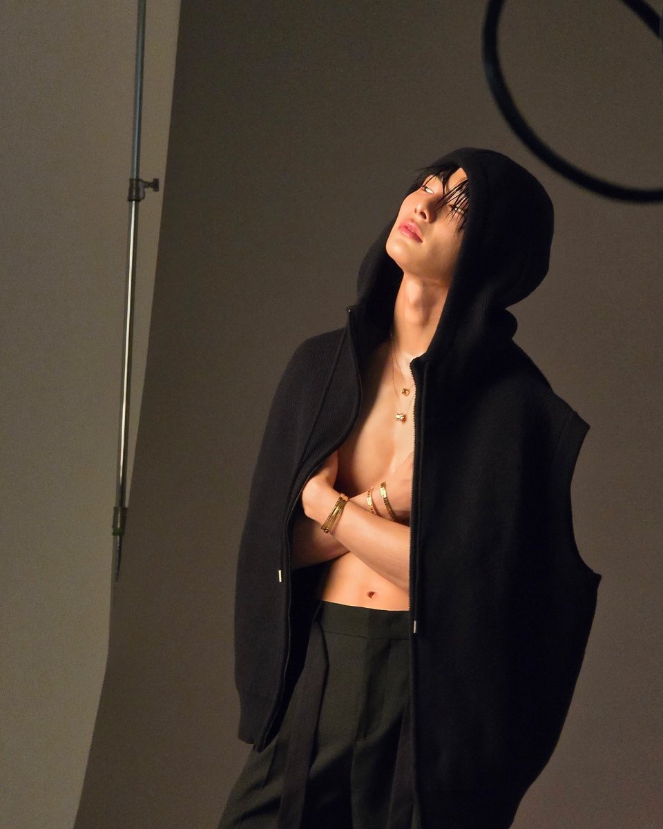why is he holding his boobs like that does he need a bra or something