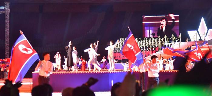 Korea_Friend_UK's tweet photo. While chaos reigns in puppet fascist south Korea the DPRK New Year performance is continuing at the May Day Stadium. No doubt 2025 will be a year of a great leap forward for People's Korea and further decline for the puppet south https://t.co/S3wJWjKIGA
