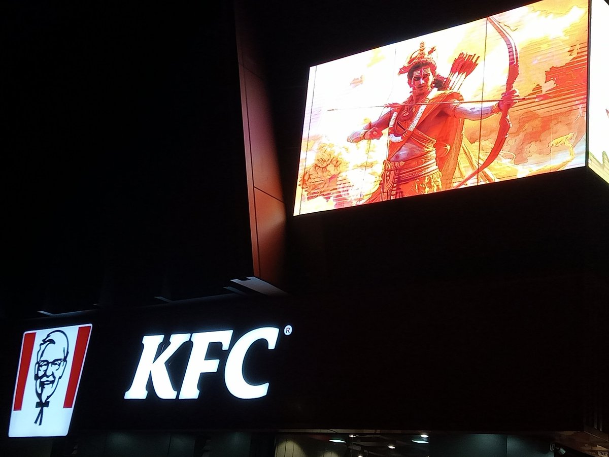 iamujjsh's tweet photo. When I was returning from the gym, I saw the banner of Lord Ram &amp; Krishna above KFC Chicken, which we should oppose so that no one can dare to do this in future and strict action should be taken against the franchise owner @jaipur_police #bann_kfc_chicken #kfc_chicken @KFC_India https://t.co/jQZHn2oiDz