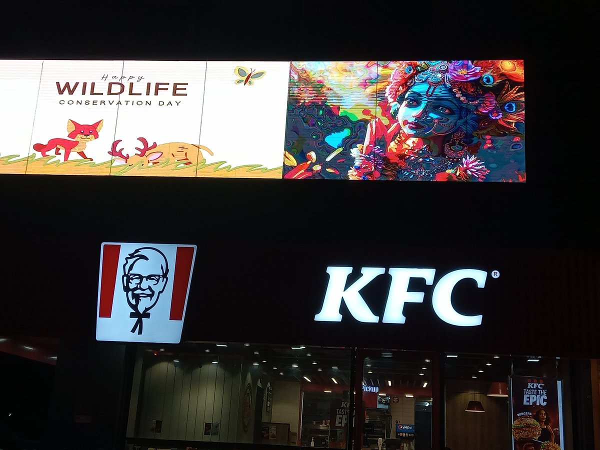 iamujjsh's tweet photo. When I was returning from the gym, I saw the banner of Lord Ram &amp; Krishna above KFC Chicken, which we should oppose so that no one can dare to do this in future and strict action should be taken against the franchise owner @jaipur_police #bann_kfc_chicken #kfc_chicken @KFC_India https://t.co/jQZHn2oiDz