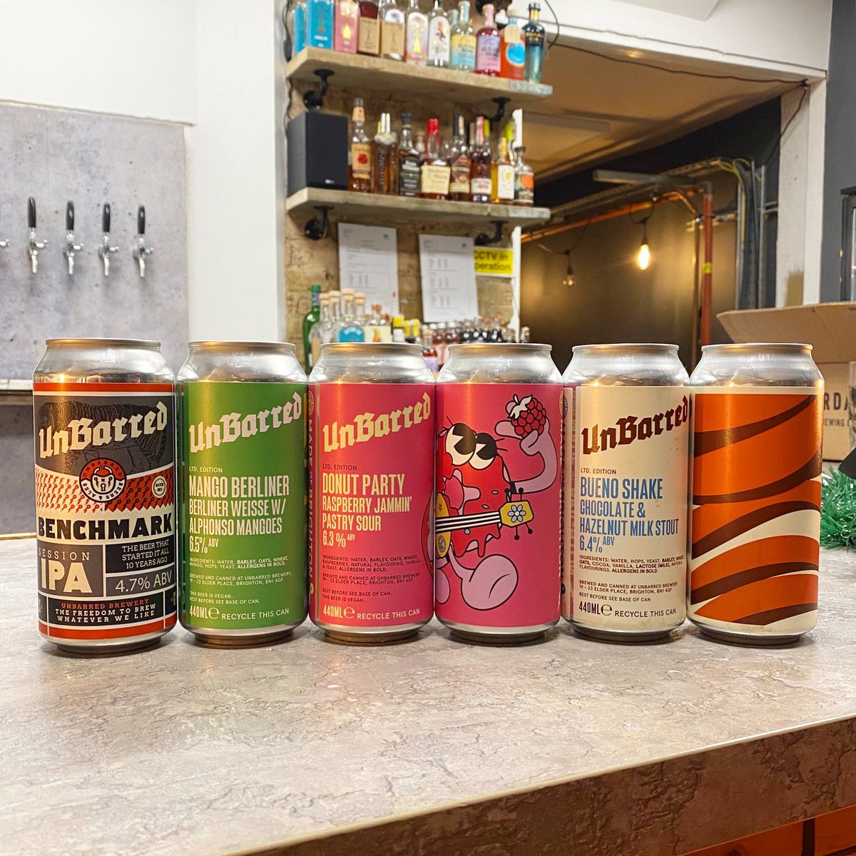 CraftTooting's tweet photo. NEW #UnBarred ‘Benchmark’ Session IPA w/ Amarillo & Simcoe hops 🤤 Mango Berliner Weisse 🥭 ‘Donut Party’ Raspberry Jam Pastry Sour PLUS ‘Bueno Shake’ IS BACK 🍫 #Craft #Tooting #Craftbeer #Bar & #BottleShop open late! #TootingBroadway #beer #beers https://t.co/waoZirE3Y2