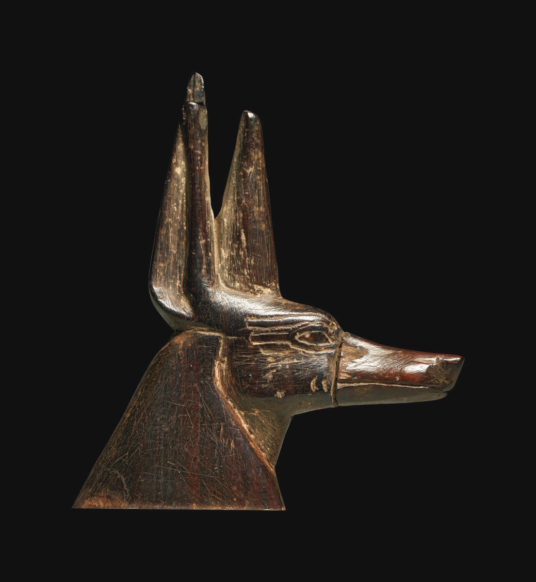 egyptomuseum's tweet photo. An Egyptian Ebony Inlay Head of Anubis

New Kingdom, 18th-19th Dynasty, ca. 1540-1190 BC.
ex Sotheby's. Now in the Private Collection. https://t.co/m3m92VozqE