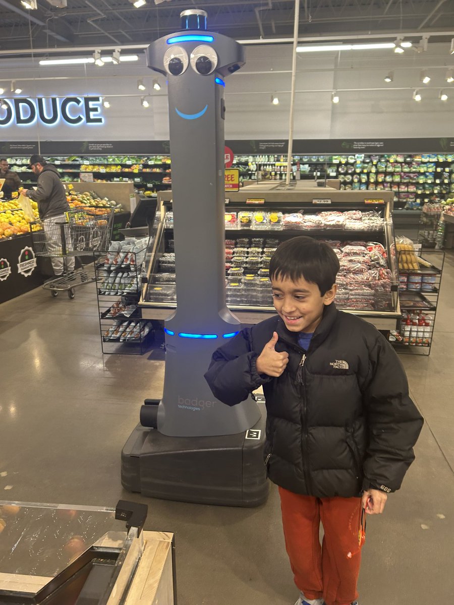 Zakir w/ his best friend, #Marty the <a href="/StopandShop/">Stop & Shop</a> robot. I used to joke while grocery shopping that Marty was his bff, which he vehemently denied. But then I bought him a Marty stuffie as a Christmas gag gift &amp; he was ECSTATIC so here we are, a boy and his grocery store robot