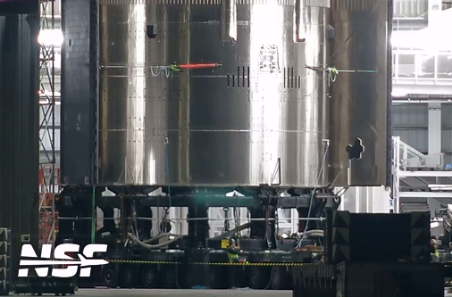 TrackingTheSB's tweet photo. Ship 33, the first block 2 ship has been lifted onto a transport stand ahead of a rollout to the launch site.
Ship 33 likely has FTS installed per the placard on the MB.
Track Ship 33 and its rollout here: https://t.co/Hr2jtf5f2E
#SpaceX #Starbase #Starship #Tracking https://t.co/52uA7abFQI