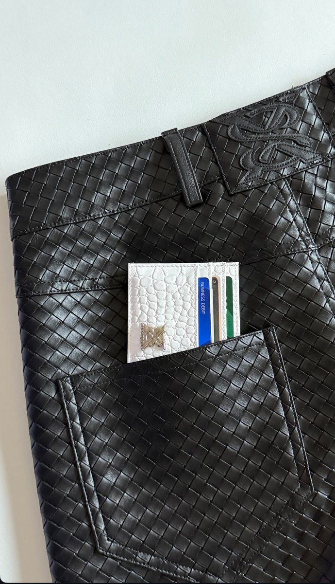 A staple accessory that catches the eye wherever you go. Fully customized white crocodile leather cardholder with a metal patch for branding! 

Let our team design and develop unique and fashionable products that will elevate your brands campaigns.