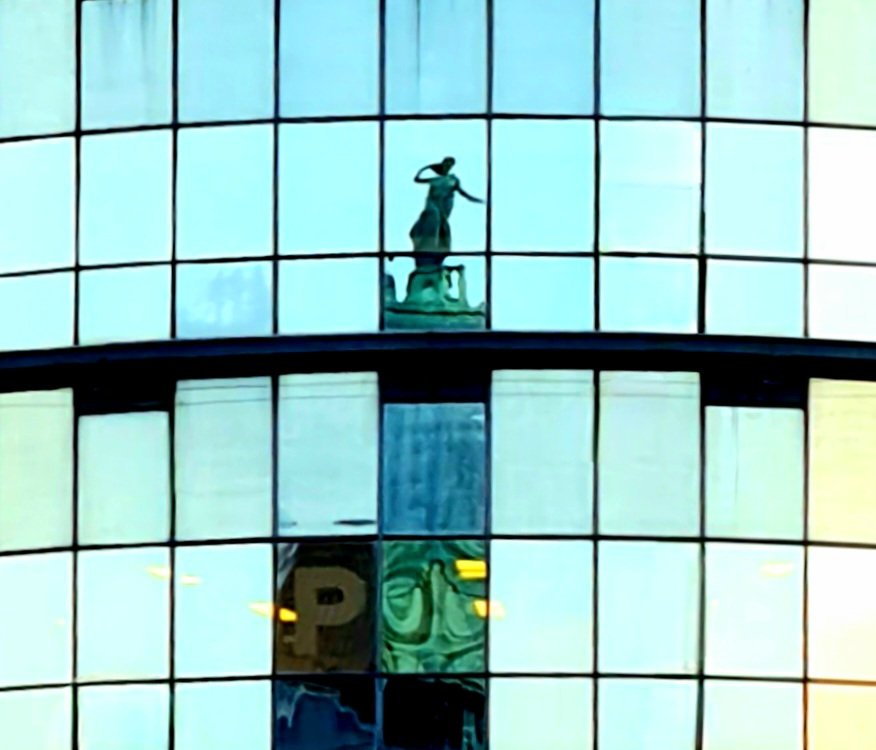 is_glasgow's tweet image. Literature by Thomas John Clapperton on the top of Glasgow&apos;s Mitchell Library reflected in the glass facade of a nearby modern building.

#glasgow #mitchelllibrary #architecture #glasgowbuildings #sculpture