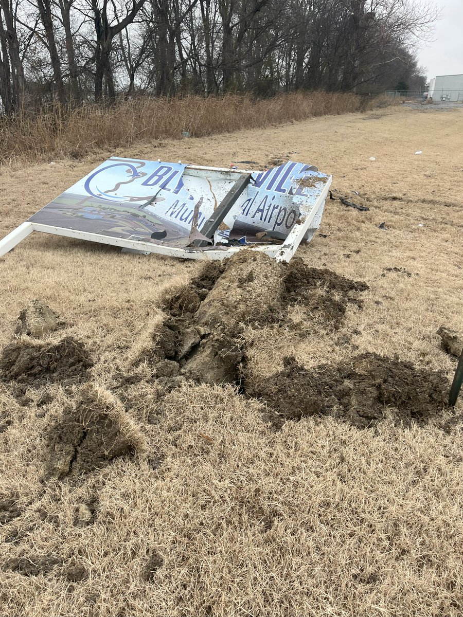 DedBytes's tweet image. Someone had a wild night. They caught air and flew right through the middle of my airport sign. Don't know the full details yet.