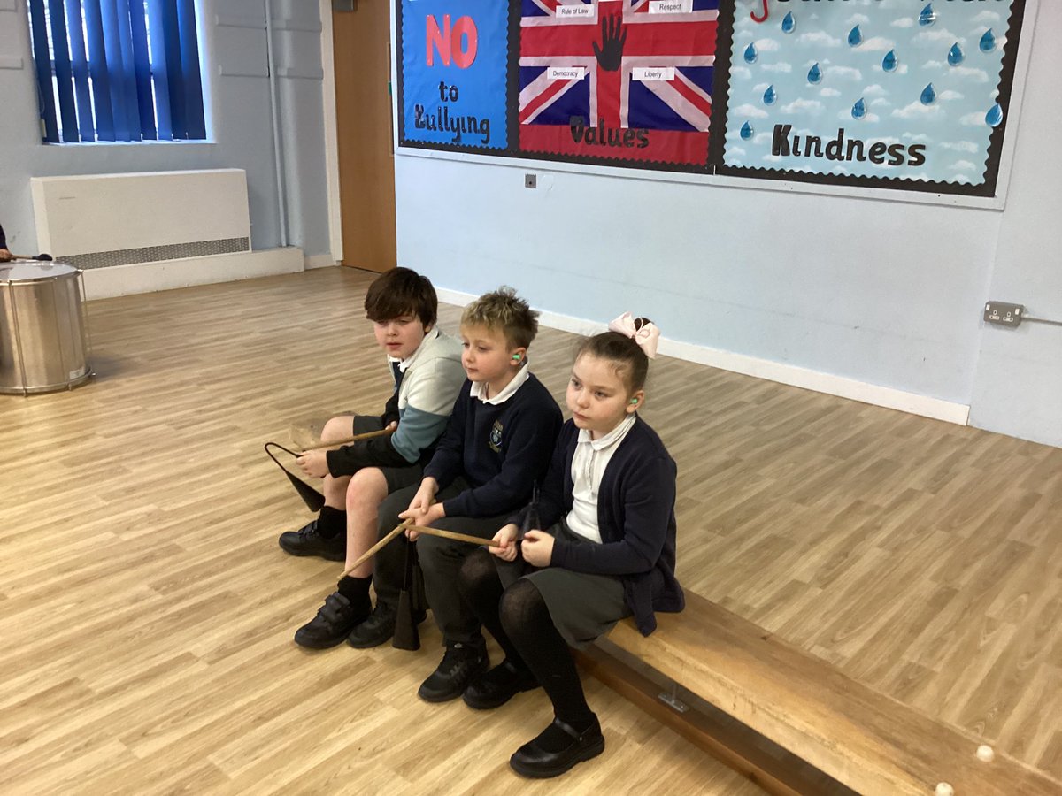 We had a fantastic music lesson today, starting our new instrument - the samba drums!