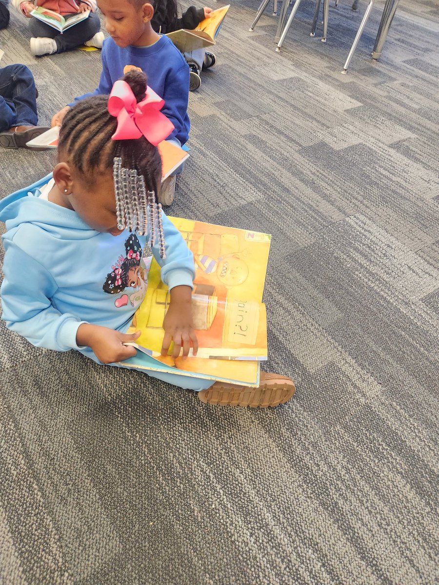 LoudBrarian's tweet image. On the first day back in the library, this kinder little was sooo into reading the pictures in this book.  They were ao happy to share them after they &quot;read&quot; thier book   Librarian Heart Happy #ALLIBRARIES