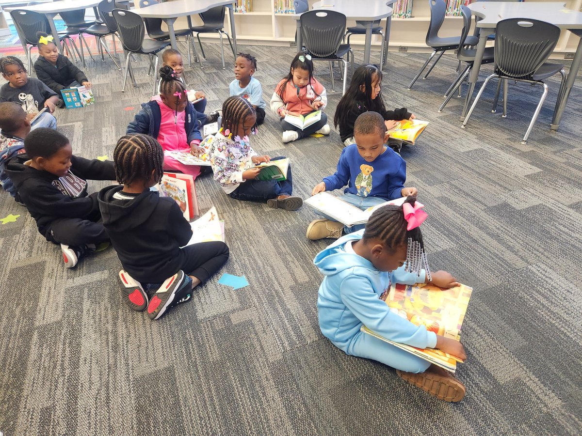 LoudBrarian's tweet image. On the first day back in the library, this kinder little was sooo into reading the pictures in this book.  They were ao happy to share them after they &quot;read&quot; thier book   Librarian Heart Happy #ALLIBRARIES