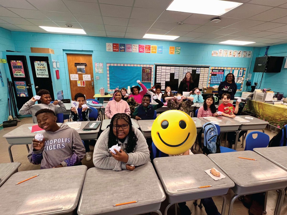 Today was a blast! Community Classroom Connections volunteers, Anna Day and Tiffany Cannon from Naheola Credit Union visited Ms. Dansby's 4th graders at US Jones.  They discussed credit unions and saving money! Everyone got a doughnut and an NCU piggy bank to take home too! 🍩💰