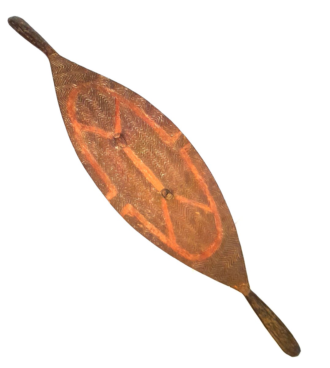 ConservationBob's tweet image. Ipswich Museum conservation. Oval decorated shield from Australasia. Terminal has broken. The terminal was re-attached with neutral acid free PVA in water. Gap filled with glass micro balloons in Paraloid B72.  Carefully rubbed down and retouched with water soluble paint.