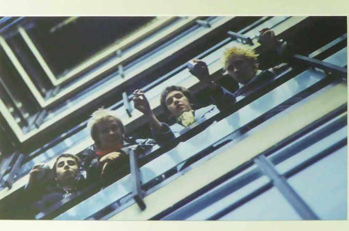 BeatlesEarth's tweet photo. Nirvana, The Sex Pistols, The Arctic Monkeys, and The Beatles themselves re-creating The Beatles' iconic debut album stairwell photo: https://t.co/nLFEfNTsgU
