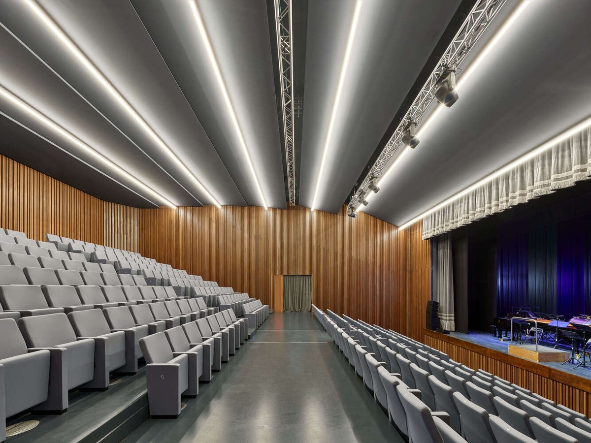 ArchDaily's tweet image. Teatro Bordoni redefines civic #architecture with its rusticated #concrete, aluminum loggias, and glowing translucent #polycarbonate fly tower, integrating cultural and communal spaces while revitalizing the industrial zone with open public areas. ow.ly/tGIy50ULFxG