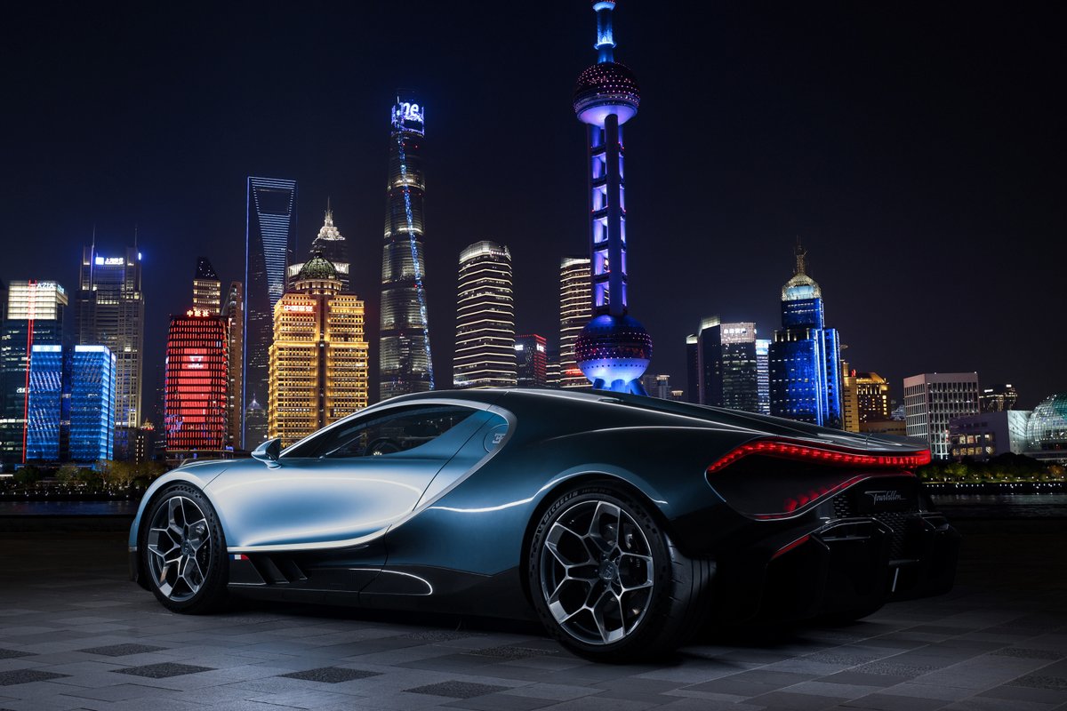 Bugatti's tweet photo. The BUGATTI TOURBILLON illuminated Shanghai, showcasing a striking fusion of heritage and innovation in every form. A timeless hyper sports car that echoes a city where the past meets the future.

#BUGATTI #BUGATTITourbillon #TOURBILLON
–
https://t.co/mCEE0gi604 https://t.co/9ja05E9BdO