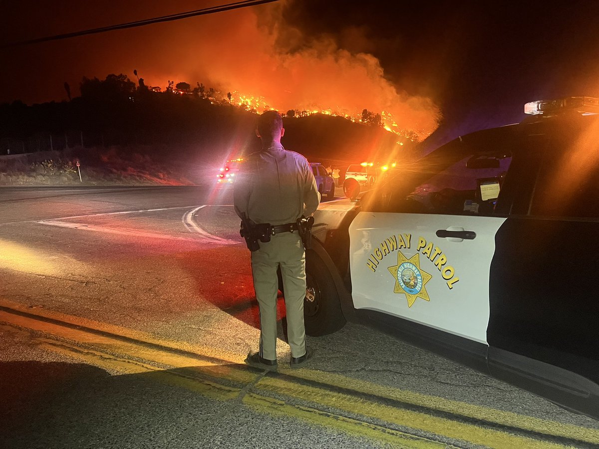 CHP_Oceanside's tweet photo. ** SIGALERT**

Expect delays along Interstate 15 from Mission Road to Old Hwy 395 as multiple brush fires have broken out along the hillsides. As of now there are no lane closures but please use caution and expect delays in the area.  #TrafficAlert #CHP #CommuteTraffic #fire https://t.co/XQadrRb97w