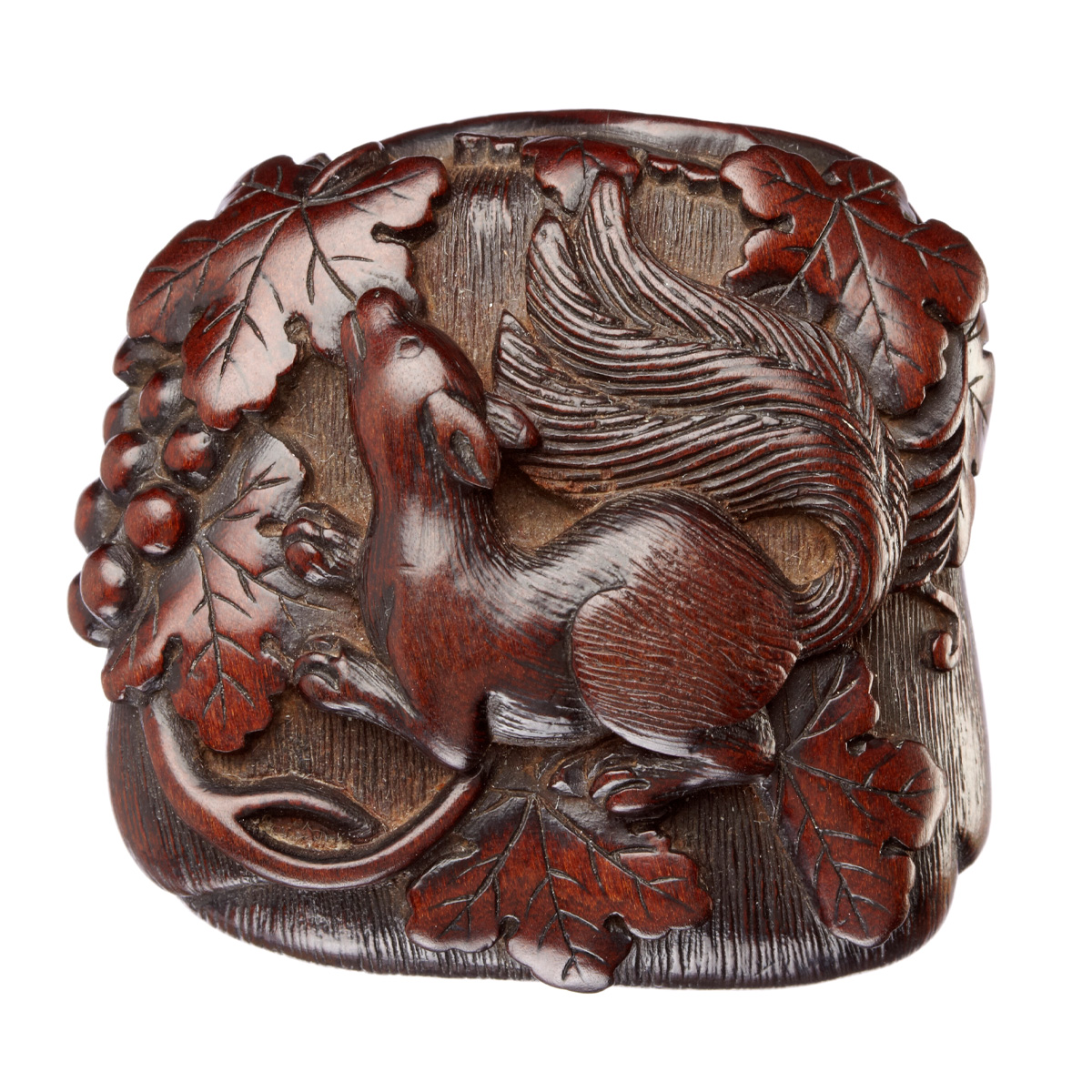Happy Squirrel Appreciation Day! 

We have a number of artistic interpretations of our bushy-tailed friends in our collection. In Japanese (and Chinese) art, the motif of squirrels and grapes often symbolizes prosperity, fertility, and abundance.

This carved, wooden Japanese