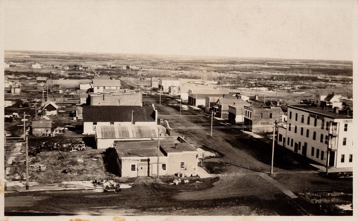 Mortlach Saskatchewan, with Union Hotel in foreground, apprx 1910s postcard.