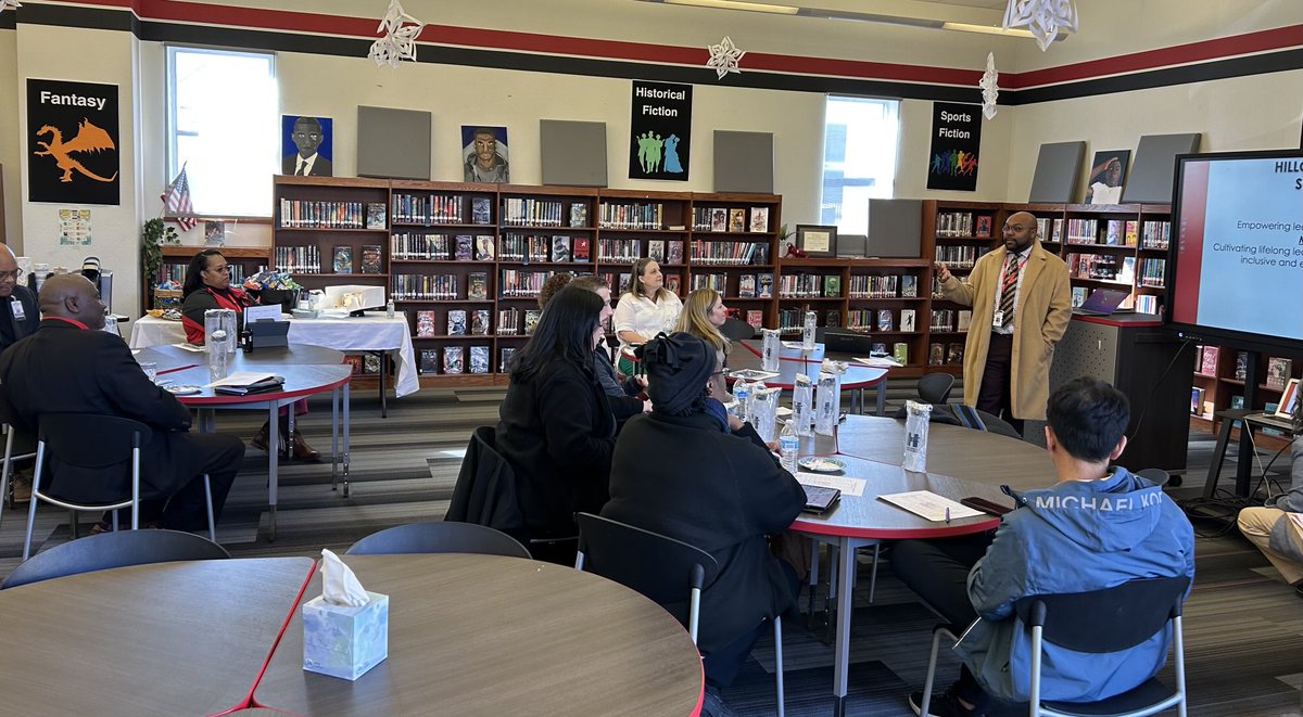 The Hillcrest Vertical Team coming together to learn from Principal Florie about the great things happening at Hillcrest High School!