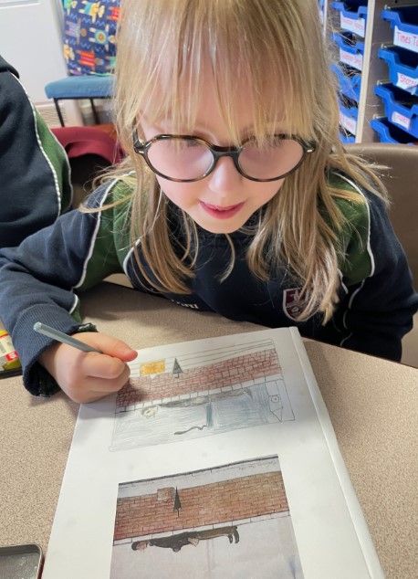 The children in Year 2 have been looking at some of L S Lowry's scenes of people. Here they are sketching some of them including "The man on the wall."