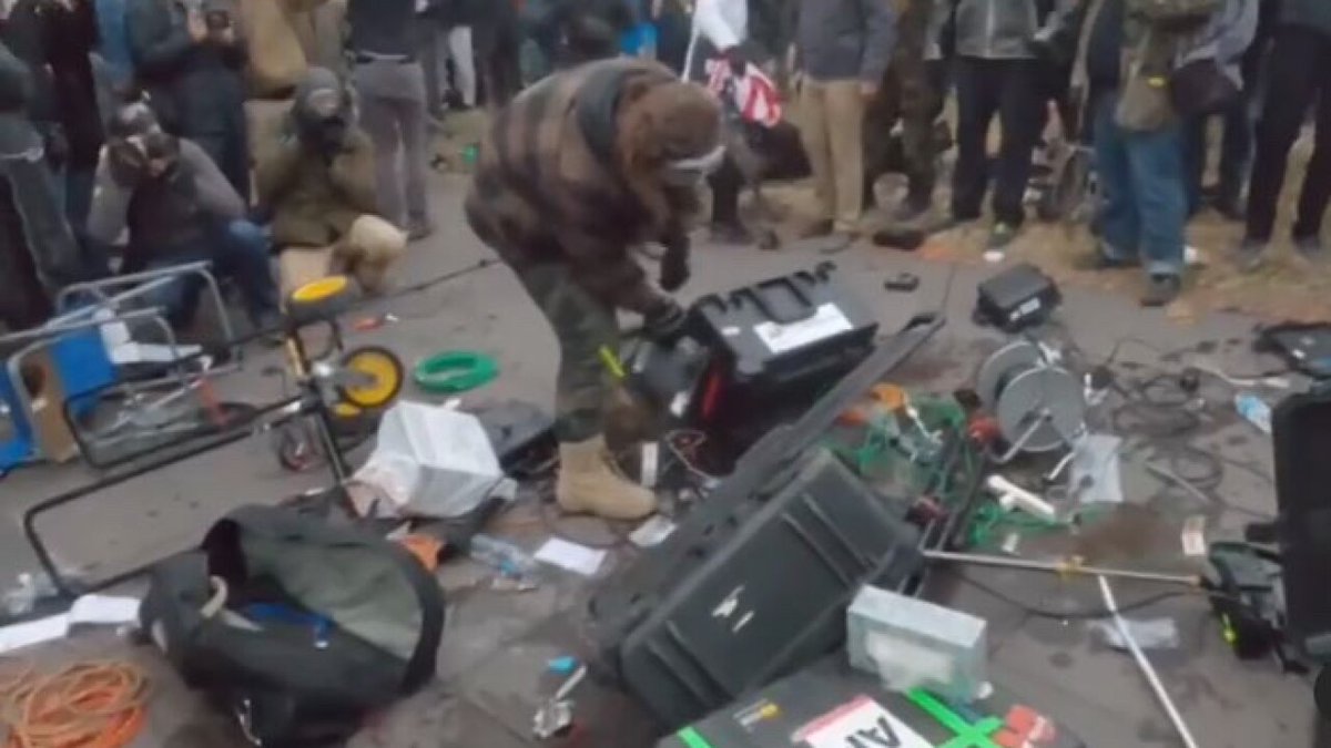 DarkMatter2525's tweet photo. @charliekirk11 And here's video of him attacking police and destroying media equipment. You're happy he is free, despite his crimes, because you agree with him politically. You care not about law &amp; order. https://t.co/BBX23DS4Bv