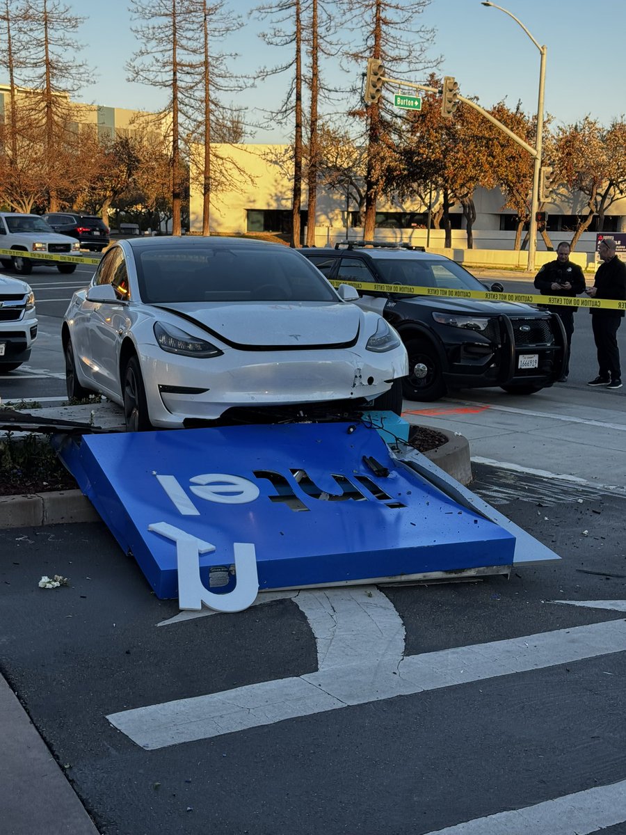 Yannis_AI's tweet photo. Looking for a better caption. Tesla runs over Intel sign at Intel HQ in Santa Clara this morning. #nobodyhurt #notGenAI https://t.co/VqoN2H6gT4
