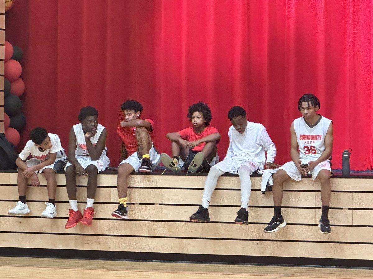 Cheering on their teammates in basketball <a href="/Community_Prep/">Community Preparatory School</a>