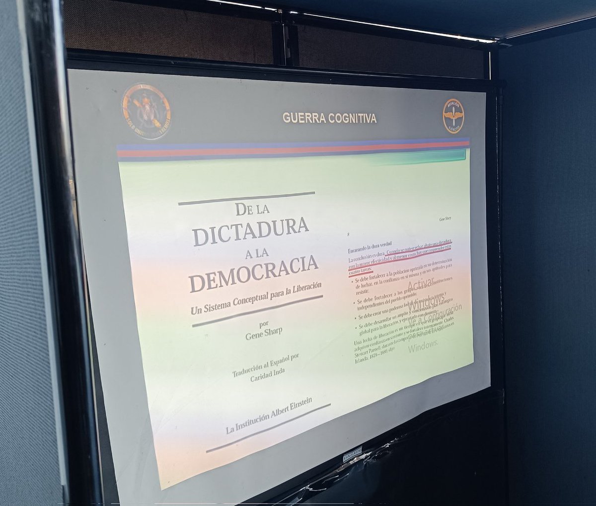 ConflictsW's tweet photo. An interesting photo posted by the Venezuelan army aviation account from La carlota airbase shows soldiers receiving a lesson on ‘cognitive warfare’ in which they analyse the book ‘From Dictatorship to Democracy’.
This is the passage being analysed by the soldiers… 
#Venezuela https://t.co/rcfEjwCWgd