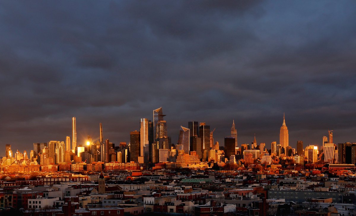GaryHershorn's tweet photo. A few minutes of color on an otherwise grey day in New York City as the sun sets on midtown Manhattan and the Empire State Building, Saturday evening #newyorkcity #nyc #newyork #sunset @empirestatebldg https://t.co/i210nyaEoZ