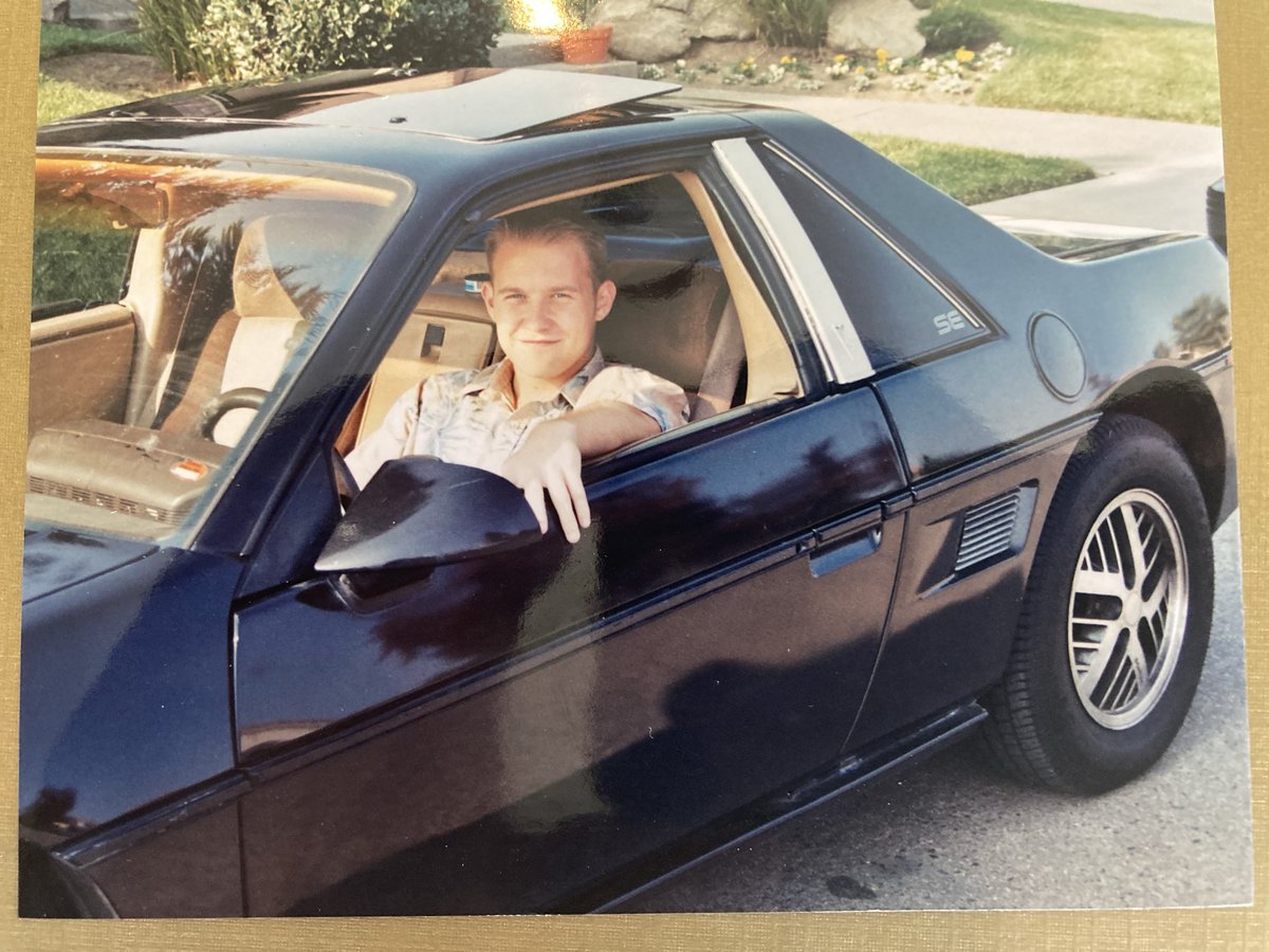 JoelLoren1's tweet photo. My first car was a 1985 Pontiac Fiero SE 2M4. It had the wheezy 2.5 I4 Iron Duke and the Isuzu 5-speed. I bought it in ‘99 for $1,100. It had a  $89 Earl Schieb paint job. It ran ok although it went through parts store starters until I fashioned a coffee can into a heat shield. https://t.co/azKLUTvixi