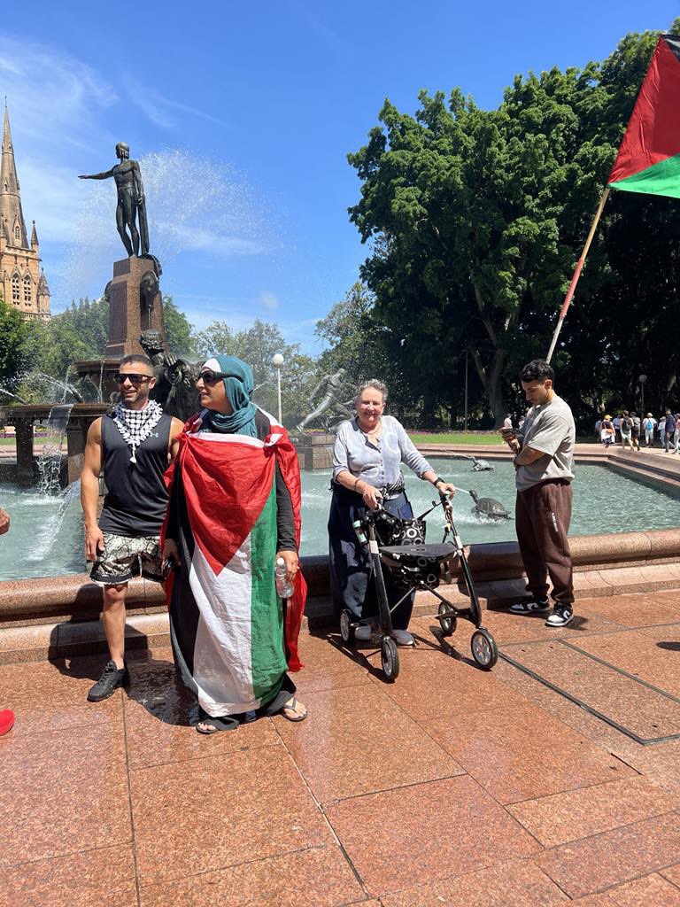 CairnesLinda's tweet photo. #sydney #week66 #freepalestine #handsofflebanon #handsoffsyria self , getting soaked by Archie, me & the new boyfriend, and some of the crowd today. https://t.co/frJUKz7vKH