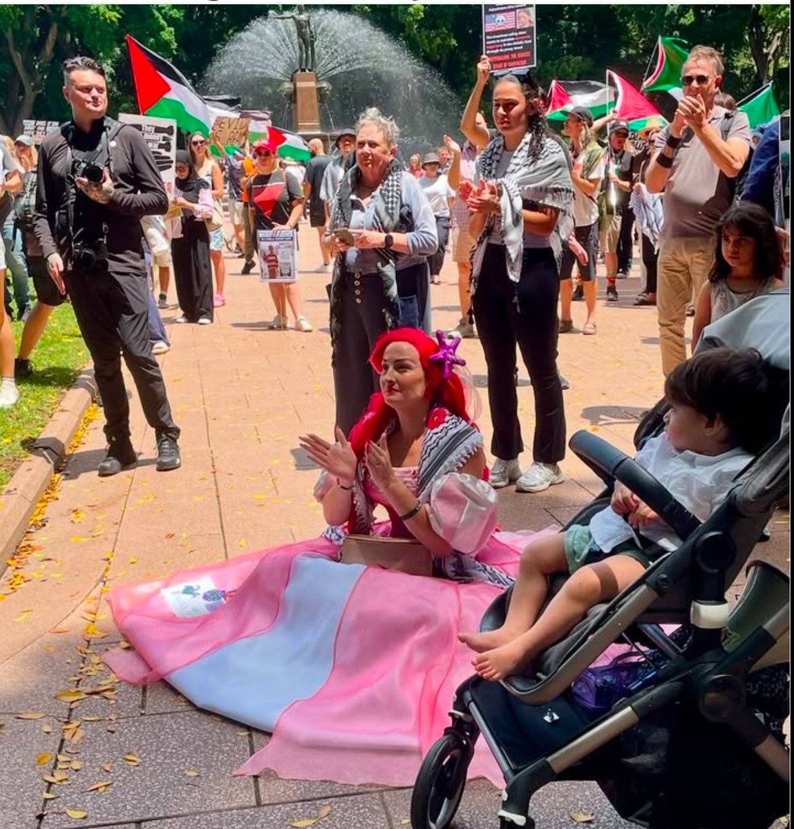 CairnesLinda's tweet photo. #sydney #week66 #freepalestine #handsofflebanon #handsoffsyria self , getting soaked by Archie, me & the new boyfriend, and some of the crowd today. https://t.co/frJUKz7vKH