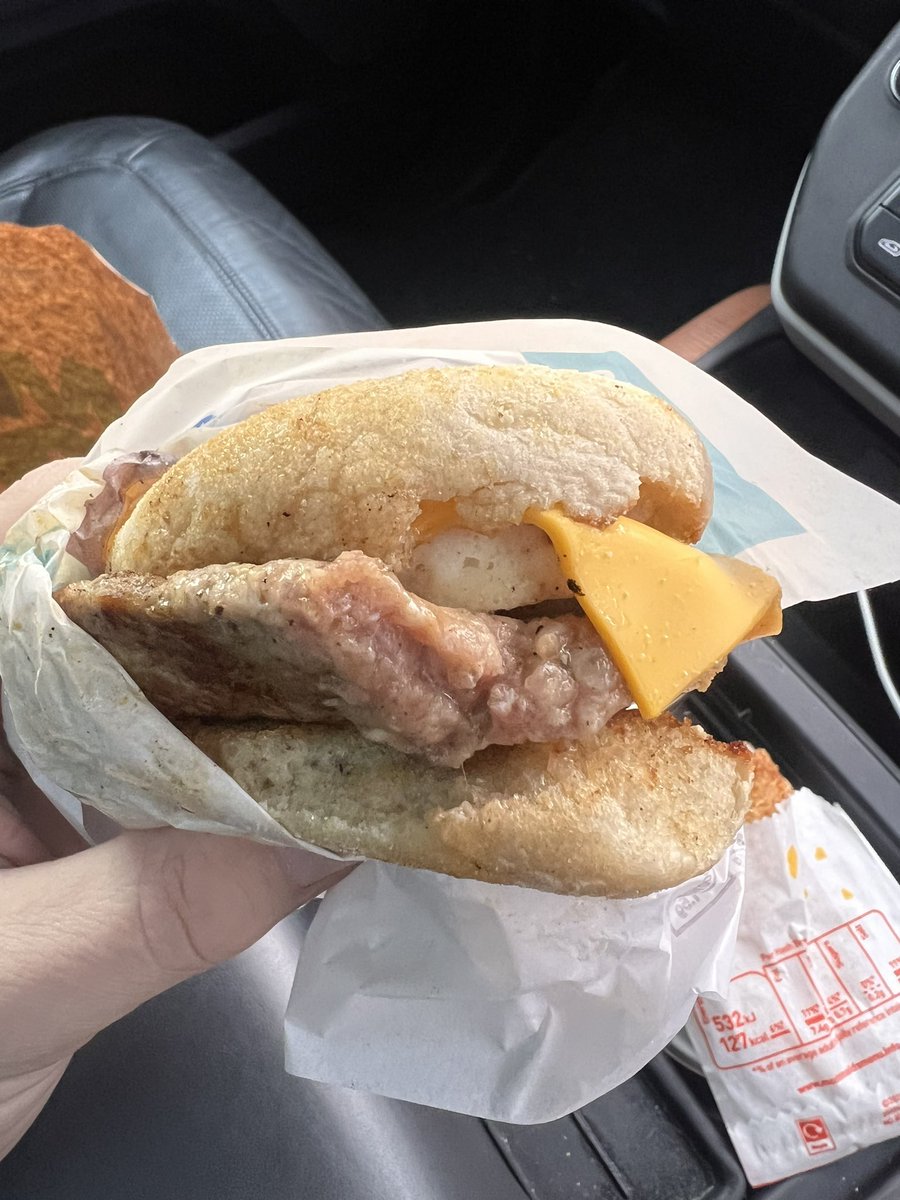 Booboollay's tweet photo. @McDonaldsUK this is the sausage and egg McMuffin I was sold in Regent st Wrexham. This is completely unsatisfactory, I just hope that I’m not sick after digesting a little bit before I realised that it was raw. Beware people. Check before you eat. It could have been a lot worse! https://t.co/E8NhDn1GrN