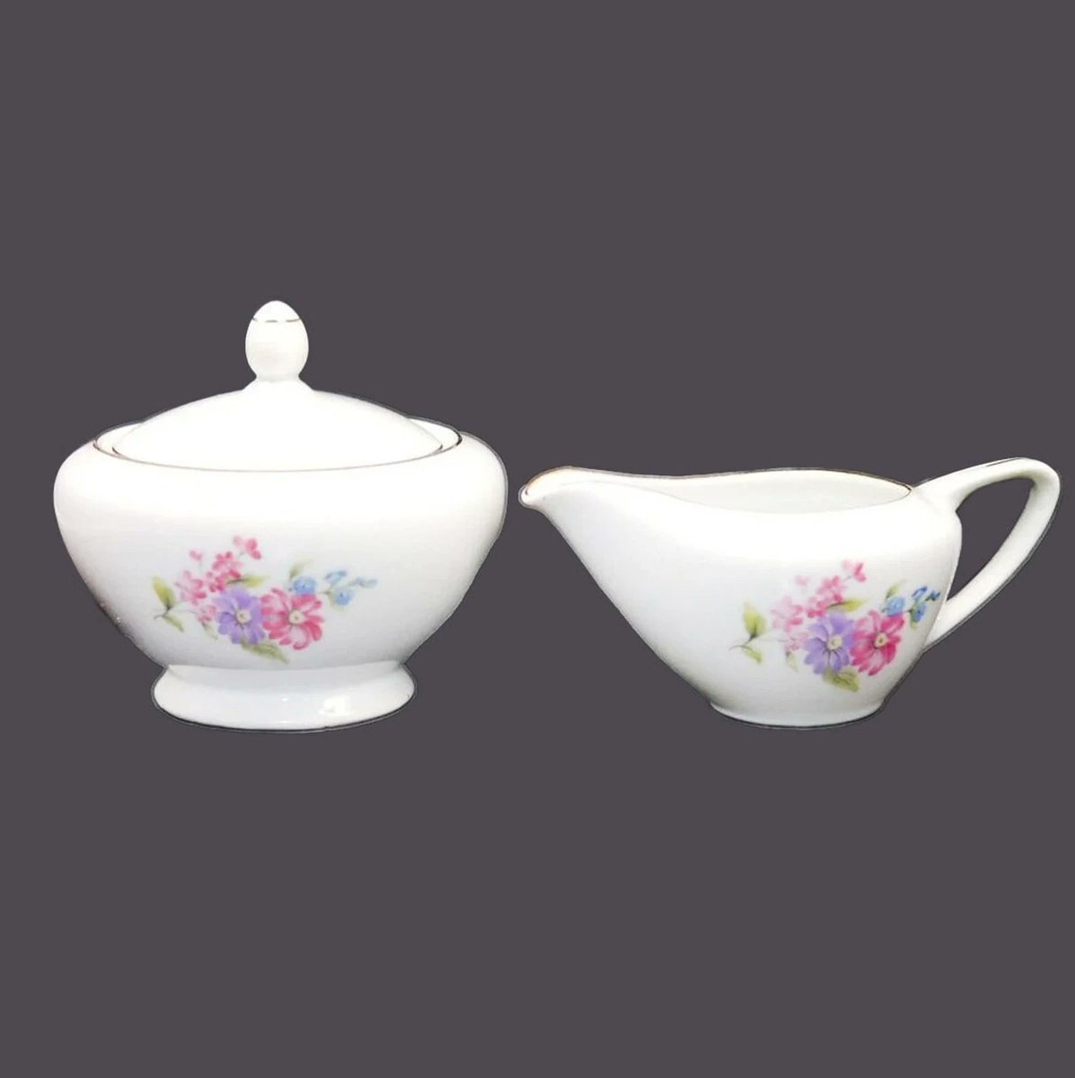 G97816960Girl's tweet photo. Leuco Fine China creamer and covered sugar bowl set. Pink, purple, blue florals made in Japan. https://t.co/CEX2vvoxs3 via @Etsy #BuyfromGroovy #antiques #tableware #tabledecor #coffeetime #teatime #Springdishes #Leuco #LeucoFineChina #Leucopinkpurpleflowers #etsysellers https://t.co/8kY3EHt1eP