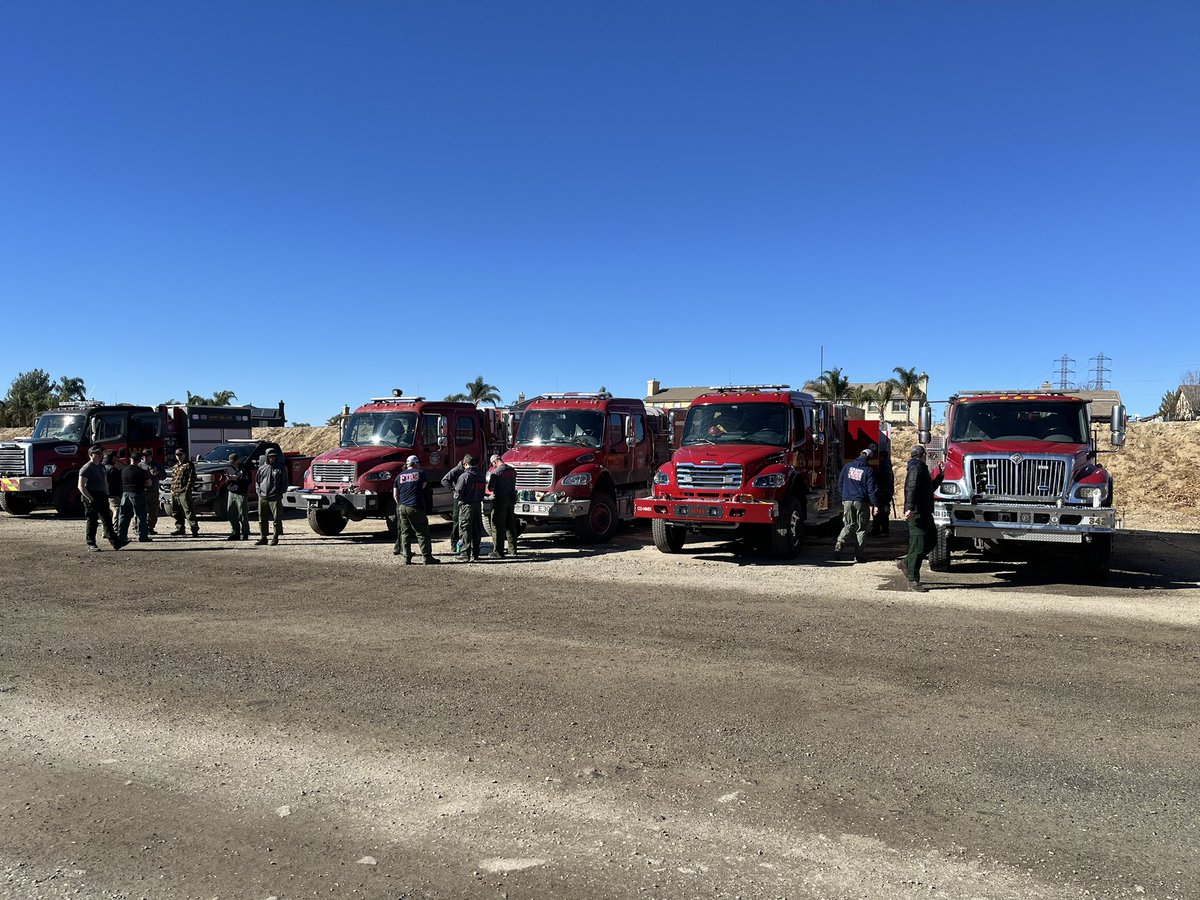 A strike team of wildland firefighters and Type 3 engines from Colorado stage outside LA County awaiting their assignment