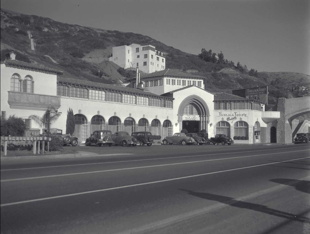 alisonmartino's tweet photo. Thelma Todd’s Sidewalk Café located at 17575 Pacific Coast Highway, has miraculously survived. Although, I read that the properties at the back of the building have not, including the house with the blue garage where Todd’s body was discovered inside her chocolate-colored Lincoln Phaeton convertible in 1935.  Thelma's Cafe has always been a favored landmark. A rare example of a 1920s neighborhood commercial building in Pacific Palisades. It was one of a few remaining examples from this period. And now it really IS the last  example. 

The last photo shows fire destruction up on the hill