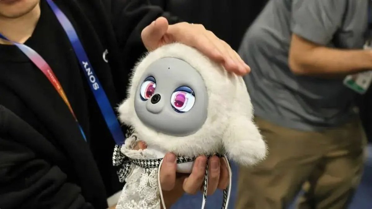 MissWow66's tweet photo. At #CES2025, meet Ropet, the plush AI companion with a cute design and furry texture! It has a built-in warming system to maintain a cozy 37 degrees, offering the real feel of a pet. ๐พโจ #TechInnovation #RachelDecodesAI https://t.co/1HH8EVDKos
